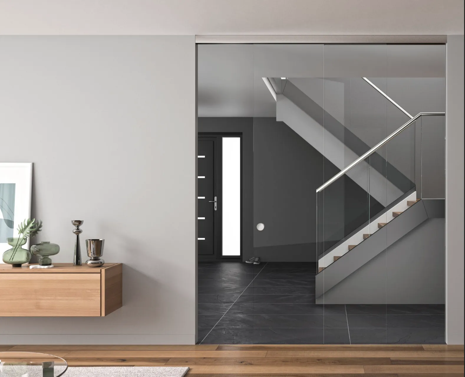 Transparante glazen wand als roomdivider tussen woonkamer en hal, met slank U-profiel en stalen look deur.